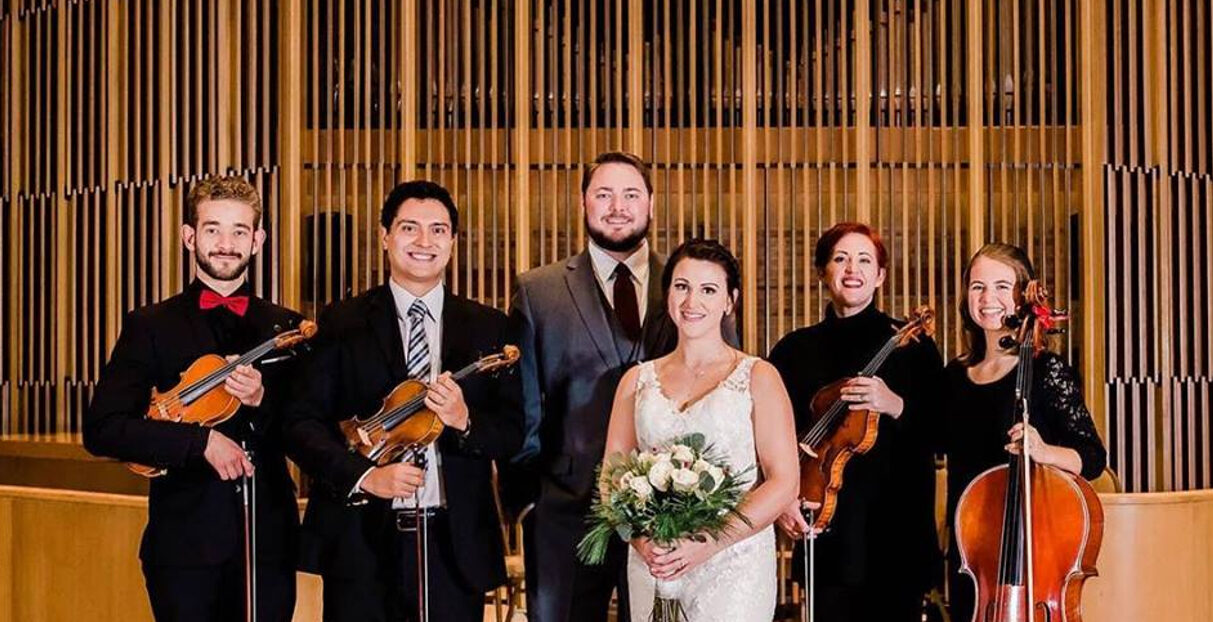 Leme Ensemble string players performing at a wedding ceremony